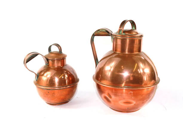 istock Vintage Copper Brass Water Jugs on White Background 813800434