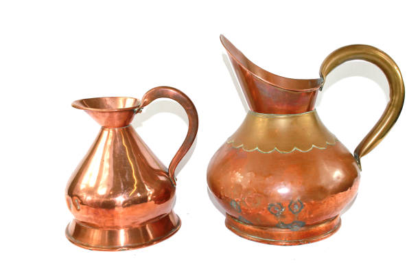 istock Vintage Copper Brass Water Jugs on White Background 813800572