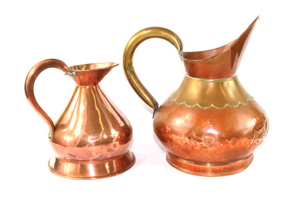 istock Vintage Copper Brass Water Jugs on White Background 813800712