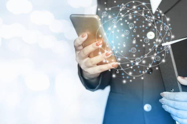 istock businesswoman hand holding smart phone with networking icon 813803096