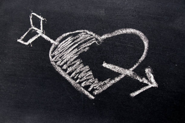 istock White chalk drawing in heart with arrow shape on black board background use for decoration in valentine, love, couple or engagement concept 813803620