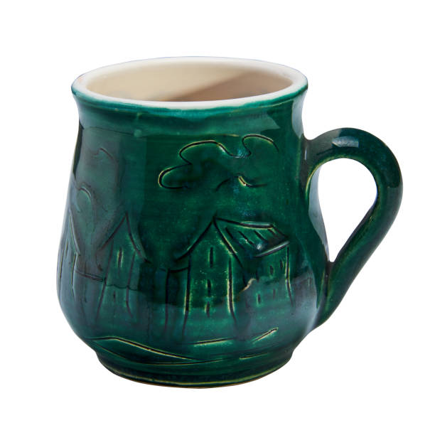 istock Colorful covered with glaze ceramic handmade mug. Isolated on a white background 813806600