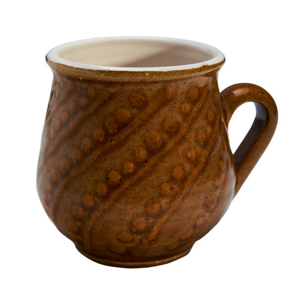 istock Colorful covered with glaze ceramic handmade mug. Isolated on a white background 813806666