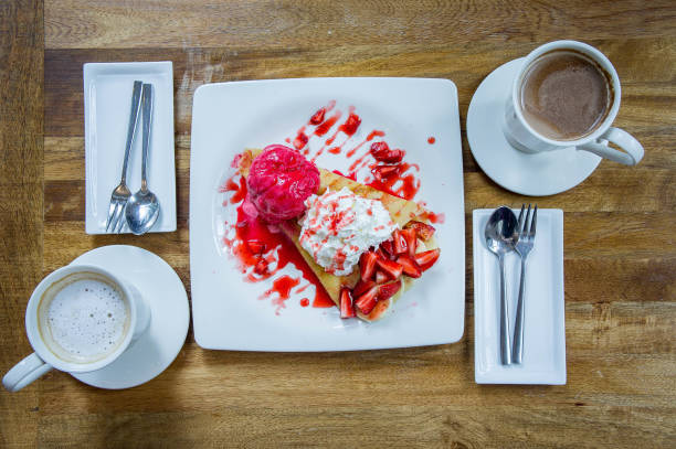dessert ice cream strawberry crepe and hot drink in coffee shop - coffee time restaurant imagens e fotografias de stock