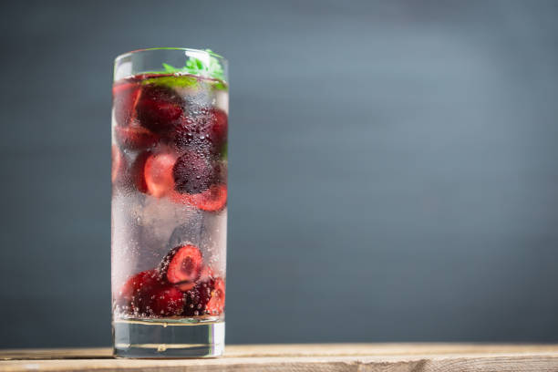 istock Cherries mojito on the wooden background 813822026