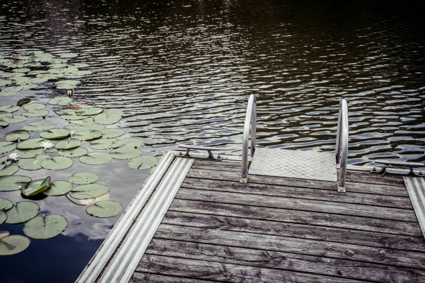 Fishing jetty on a small lake in sunlight