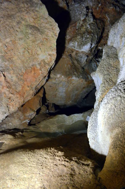 istock Picturesque karst features illuminated in the cave 813825814