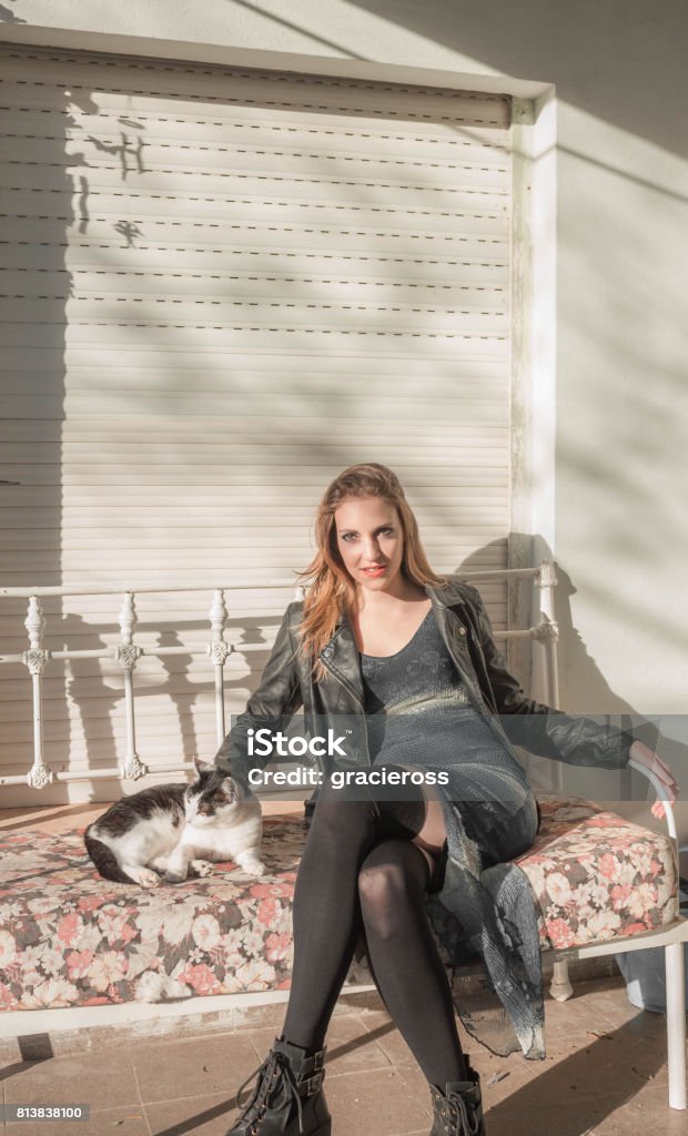 Beautiful woman sitting with kitten Beautiful woman looking to the kitty 20-29 Years Stock Photo