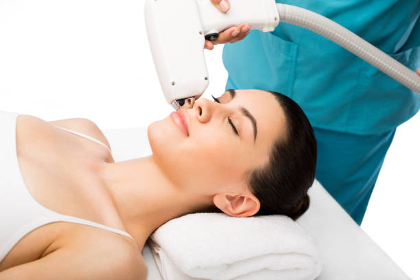 istock Woman getting beauty treatment on face 813839524