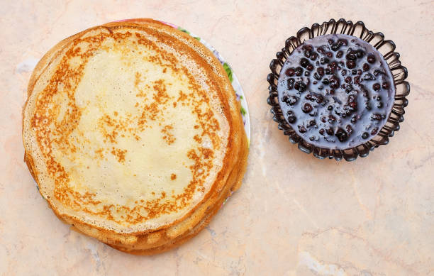 istock Pancakes with raspberry jam on the table. Maslenitsa Festival 813839934