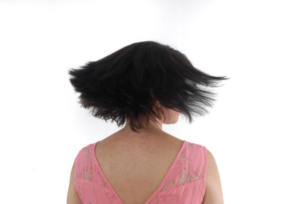 istock A woman moving her head on white background 813842322
