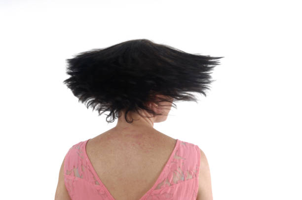 istock A woman moving her head on white background 813842630