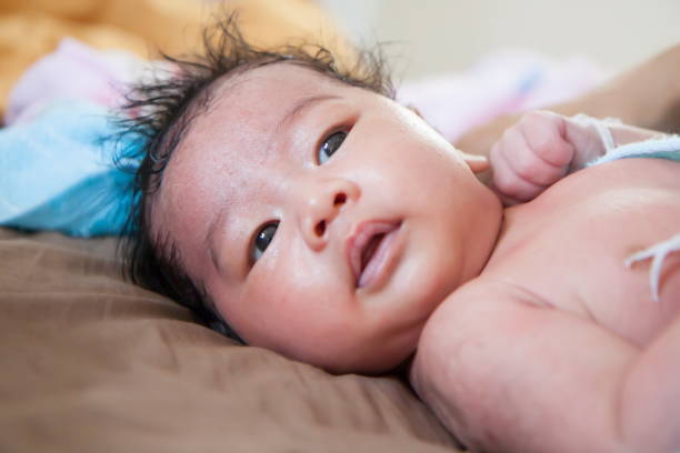istock Baby happy on the bed 813843694