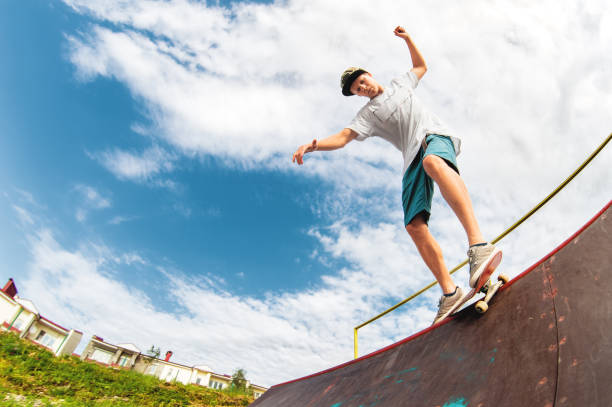 istock Young boy doing the trick on the ramp 813848182