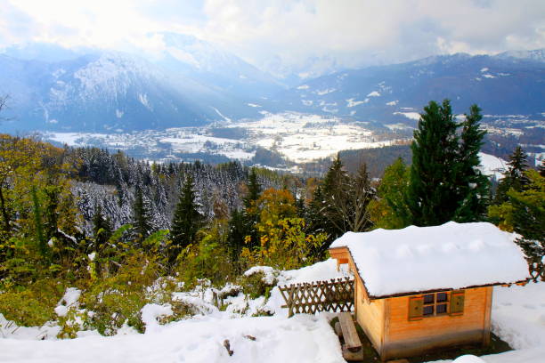 istock Rustic barn under snow and Waxenstein  Bavarian Alps, idyllic Pine trees woodland under snow landscape, majestic alps valley, dramatic Bavaria german Snowcapped mountain range panorama, Berchtesgaden alps, Germany 813848360