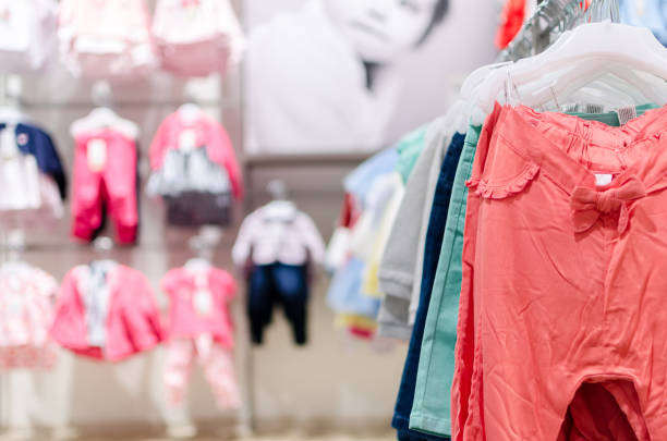 clothes in store Selling clothes in a shopping mall in the store baby boutique stock pictures, royalty-free photos & images