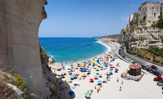 Tropea, Calabria - July, 1, 2017: Tyrrhenian Sea and the skyline of Tropea, one of the most famous tourist destinations in the southern Italy, a famous bathing place situated on a reef in the gulf of St. Euphemia