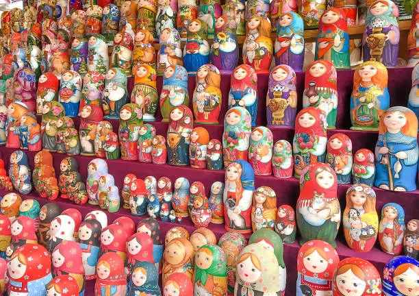 Photo of Beautiful colourful wooden dolls matryoshka at market.