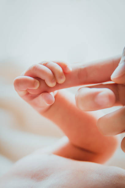 istock Finger of newborn 813878172