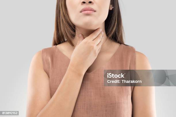 Sore Throat Woman On Gray Background Stock Photo - Download Image Now - Thyroid Gland, Women, Gastroesophageal Reflux Disease