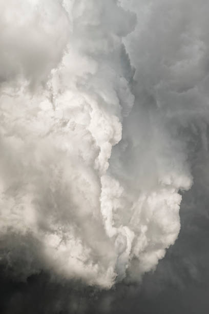 istock Billowing Cumulus clouds into Cumulonimbus storm clouds 813894906