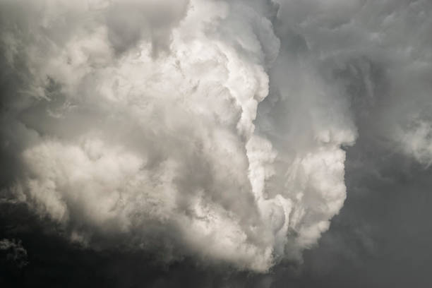 istock Billowing Cumulus clouds into Cumulonimbus storm clouds 813894966