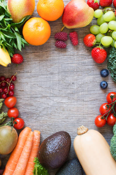 istock Different fruits and vegetables on wooden table 813895138