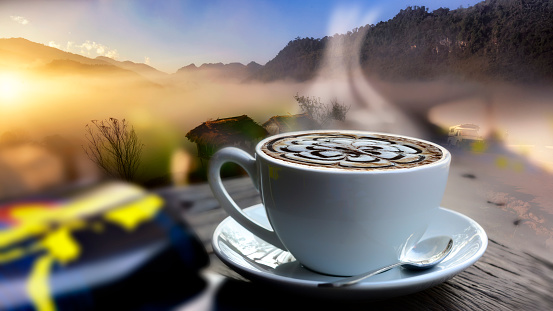 cup of hot coffee in nature background.