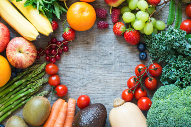 istock Different fruits and vegetables on wooden table 813895462