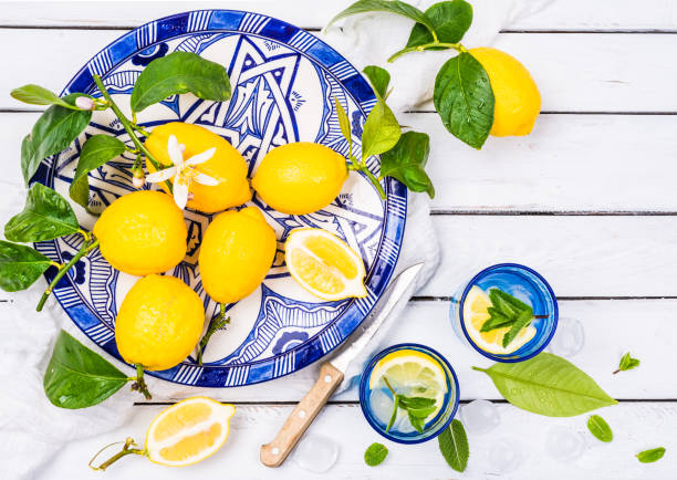 istock Fresh lemons and glass with infused water. 813898514