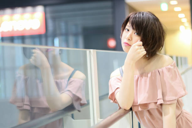istock Happy Beautiful Japanese girl texting 813901394
