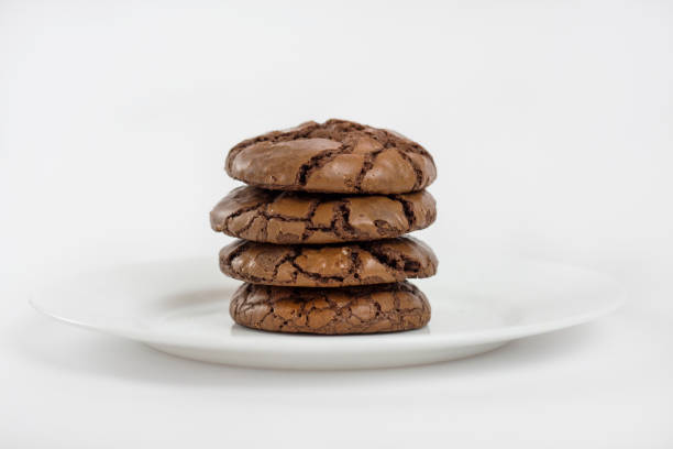 istock Black Brownie Cookies on white plate 813901420
