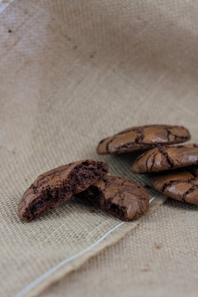 istock Black Brownie Cookies on a rustic burlap background 813901534