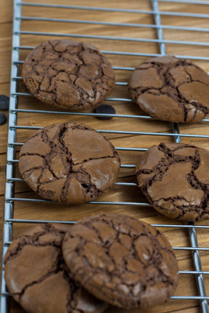 istock Black Brownie Cookies on a metallic grill cooler 813901574