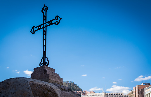 metal cross stuck in a rock in a sanctuary near Makarska