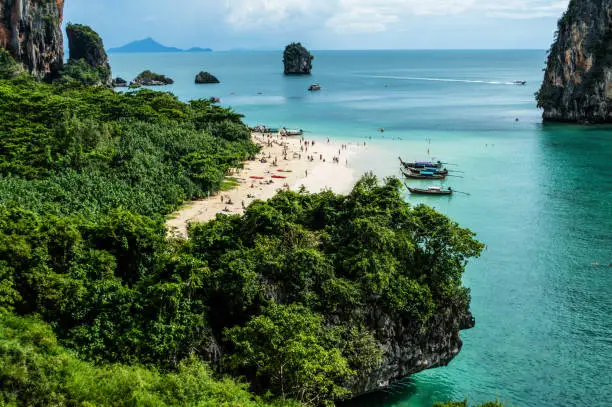 Photo of Lime Stone Formations and Beach seen from a Cave, Phra Nang, Railay Beach, Krabi, Thailand