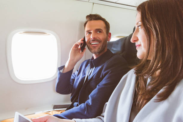 istock Happy mature people traveling by airplane 813915728