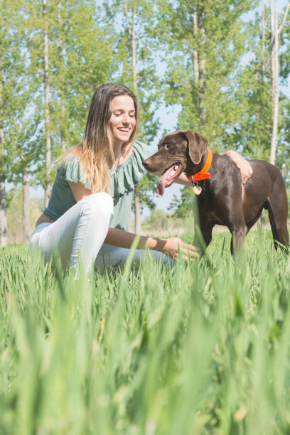 istock young woman embracing her dog 813919944