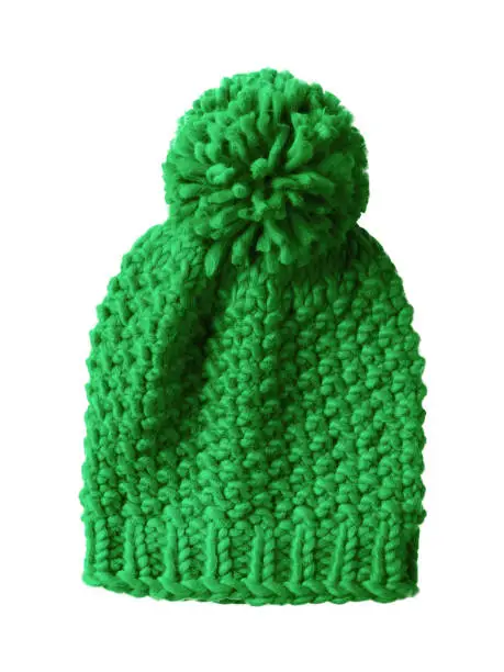 Light green woolen winter cap hat with a pom pom pompon isolated on white