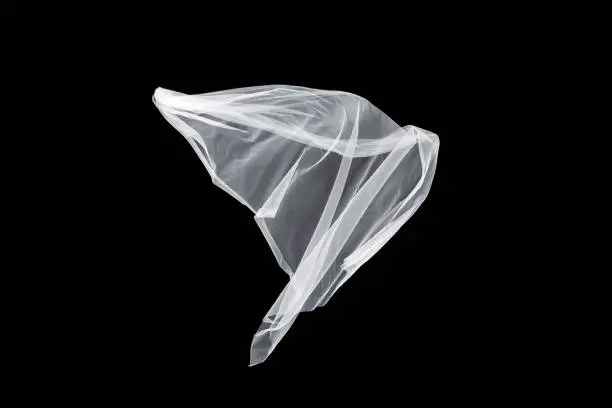 wedding white Bridal veil isolated on the black background. veil flutters in the wind