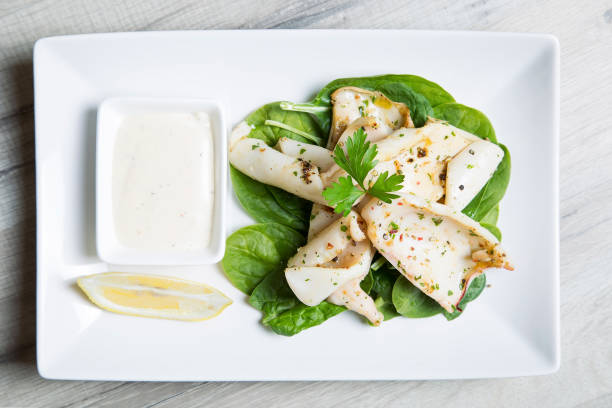 istock Grilled squid with spinach and garlic aioli 813951268