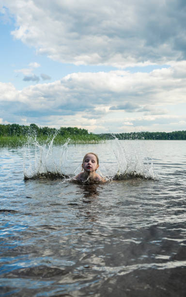 istock Girl in the lake 813955016