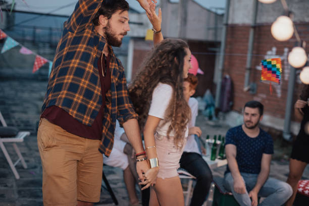 istock Friends dancing at the party 813955538