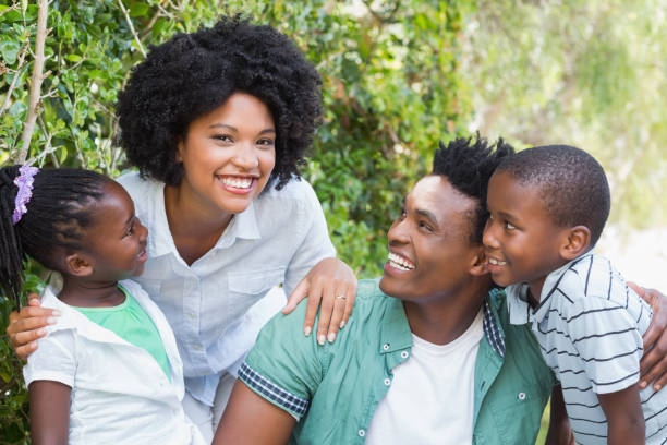 istock Happy family smiling at camera 813963022