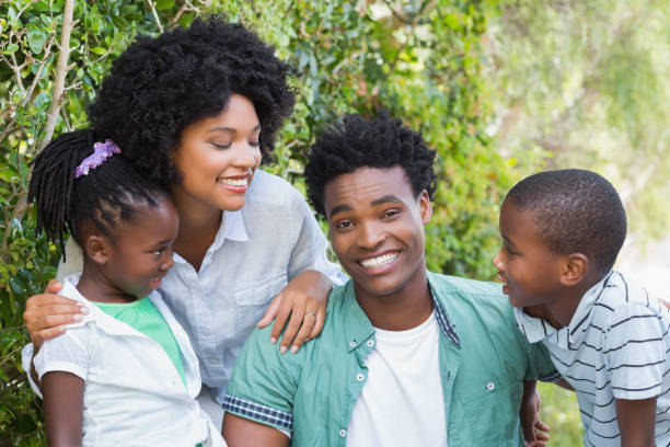 istock Happy family smiling at camera 813963064