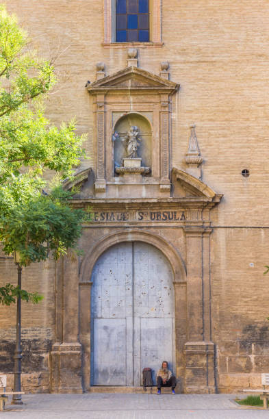 Homeless Man Sits On The Doorstep Of The Santa Ursula Church In Valencia  Spain Stock Photo - Download Image Now - iStock