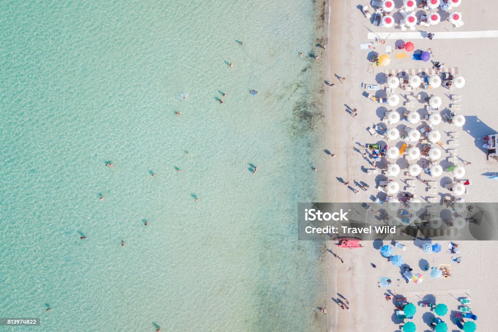 SARDINIA, ITALY, 10 JULY 2017, Aerial view of the amazing beach with colorful umbrella and people who swim. 10 JULY 2017, Sardinia is the second largest island in the Mediterranean Sea Italy Stock Photo