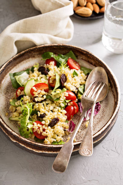 istock Warm salad with bulgur, vegetables and leaves 813987418