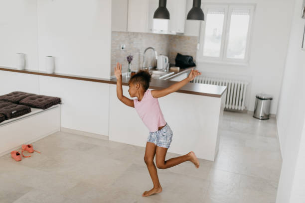 istock Beautiful african ethnicity kid is dancing in front of the mirror 813987554