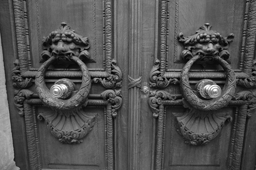 Paris, France – 12 august 2006: Elements of the input front door in the entrance of a house in Paris. 12 August, 2006. Paris, France.